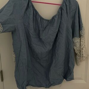 I am selling a blue and white lace shirt from Unique Spectrum.